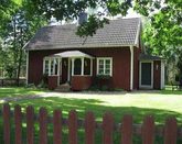 Red cottage close to lake in southeast Sweden